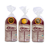 Amish Country Popcorn frente del empaque mostrando el pack de tres bolsas y variedad