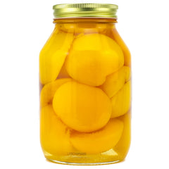 Amish Wedding frasco junto a una regla para comparar el tamaño de 32 oz útil en cocina