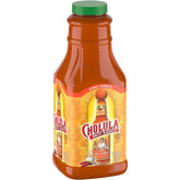 Cholula botella frontal 64 fl oz mostrando etiqueta y tamaño grande, ideal para restaurantes