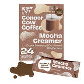 Copper Cow Coffee paquete frontal mostrando 24 sobres, conveniencia portátil