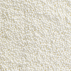 DecoPac nonpareils aplicadas sobre cupcake para acabado elegante y uniforme