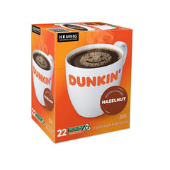 Caja Dunkin' Hazelnut junto a regla para comparar tamaño y porciones por caja