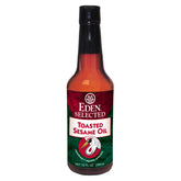 Eden botella frontal mostrando etiqueta y vidrio ámbar para conservar sabor