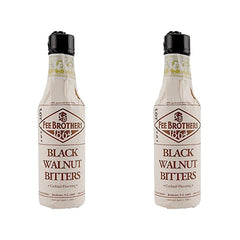 Fee Brothers botella frente mostrando etiqueta negra y beneficios aromáticos