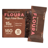 FLOURA empaque frontal mostrando barras sabor brownie y beneficios de fibra