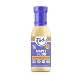 Fody aderezo Maple Dijon vista frontal mostrando botella completa y color atractivo