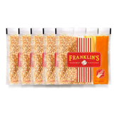 Franklin's Gourmet Popcorn paquete frontal mostrando marca y formato, conveniencia inmediata