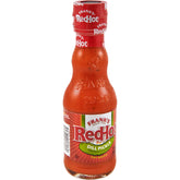 Frank's RedHot frente de botella mostrando tamaño y diseño, realza el condimento