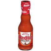 Frank's RedHot frente de la botella mostrando logo y tamaño prácticos