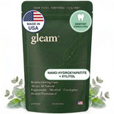 Gleam frente del empaque mostrando pouch resellable y beneficio de portabilidad