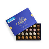 Godiva caja frontal patisserie elegante con acentos dorados y lista para regalar