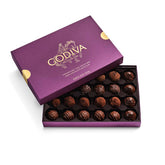 Godiva caja frontal morada mostrando 24 trufas y presentación elegante