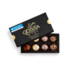 Godiva caja frontal elegante con acentos dorados mostrando 8 trufas, perfectas para regalo