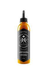 Heartbeat Hot Sauce Co. botella frontal mostrando etiqueta y color vibrante