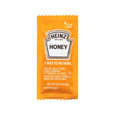 HEINZ sobre individual de miel 9 g vista frontal y logo, conveniencia para servicio