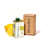 Heraclea botella frontal con limón, presentación y aroma fresco