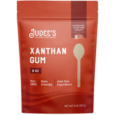 Judee's goma xantana frente del empaque muestra bolsa resellable y cantidad 8 oz