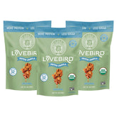 Lovebird empaque frontal mostrando sello orgánico y beneficio proteico
