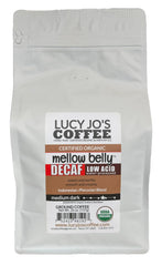 Lucy Jo's Coffee paquete frente mostrando sello orgánico y aroma equilibrado
