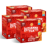Luzianne frente del empaque mostrando pack de 4 cajas y 100 bolsas cada una, práctico