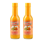 Marie Sharp's botella frente mostrando salsa mango habanero y etiqueta clara