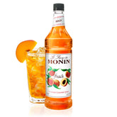 Monin botella de durazno frente mostrando presentación 1 L y uso profesional