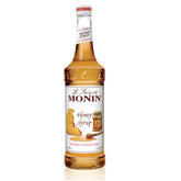 Monin Honey Syrup botella frontal mostrando etiqueta clara y volumen
