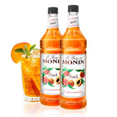 Monin jarabe de durazno botella frontal, presentación clara y atractiva
