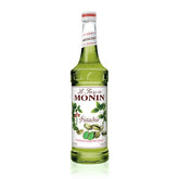 Monin Pistachio botella frontal mostrando etiqueta y sabor pistacho, mejora la preparación profesional