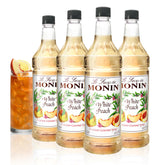 Monin botella White Peach frontal mostrando etiqueta clara y capacidad de 1 litro