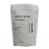 MUDWTR envase frontal mostrando la etiqueta y aspecto premium