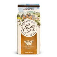 New England Coffee paquete frontal mostrando 18 oz y sabor avellana