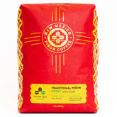 New Mexico Piñon empaquetado frontal mostrando 2 libras y beneficios de sabor
