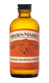 Nielsen-Massey botella frontal mostrando agua de azahar y vidrio limpio
