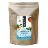 Numi embalaje frontal 1 lb mostrando sello orgánico y beneficio de ahorro