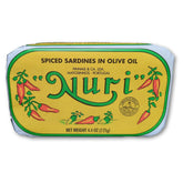 NURI vista frontal del pack de cuatro latas mostrando diseño vintage y calidad