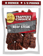 Old Trapper paquete frontal mostrando carne ahumada y beneficios proteicos