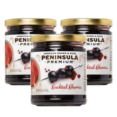 Peninsula Premium frasco frontal mostrando cerezas y jarabe, ideal para cócteles