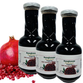 Pomegranaze botella de vidrio frontal mostrando la etiqueta y calidad orgánica