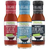 Primal Kitchen pack frontal con tres botellas mostrando variedad y conveniencia