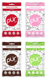 PUR Gum vista frontal del paquete surtido mostrando los cuatro tubos y beneficios sin aspartame
