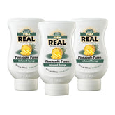 Reàl Infused Exotics pack frontal con tres botellas, sabor piña consistente