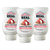 Reàl Infused Exotics lichi pack frontal mostrando tres botellas, ideal para barras