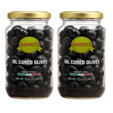 Sanniti aceitunas curadas frente mostrando frasco y aceite, perfecta para aperitivos