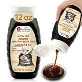 Sauce Grandmaster botella frontal mostrando etiqueta y dosificador, conveniencia de uso