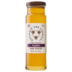 Savannah Bee Company frasco delantero mostrando miel Tupelo pura y dorada