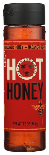 Savannah Bee Company jarra frontal con miel picante, muestra pureza y color dorado