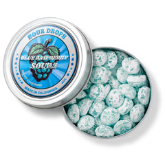 Sour Drops vista superior de latas con caramelos surtidos listos para servir