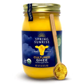 Spring Sunrise ghee frasco frente mostrando color dorado y etiqueta orgánica
