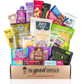 The Good Grocer caja completa abierta mostrando 20 snacks veganos variados y listos para regalar